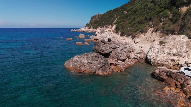 Aerial Drone Orbit of Majestic Sea Stack and Rugged Cliffs at Ermones Bay Corfu Greece