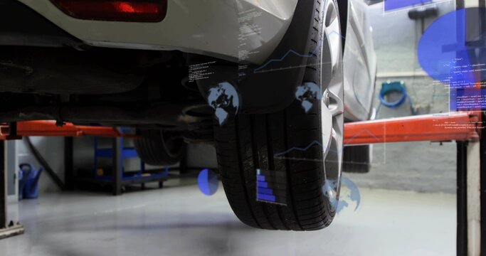 Highlighting rear-right wheel and tire hanging on red lift in service bay, with digital overlays