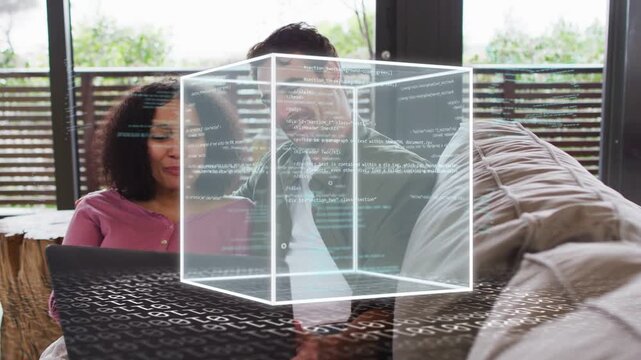 Couple sitting couch viewing laptop, cube appearing with code streams, man pointing, exploring tech