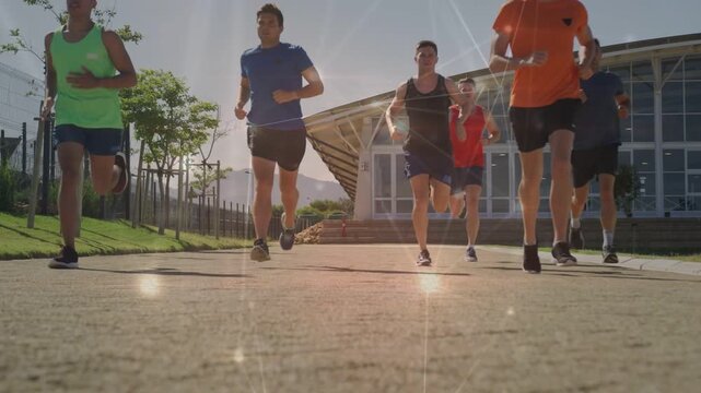 Six runners starting training run toward low cam, tightening formation with sparkle accenting feet