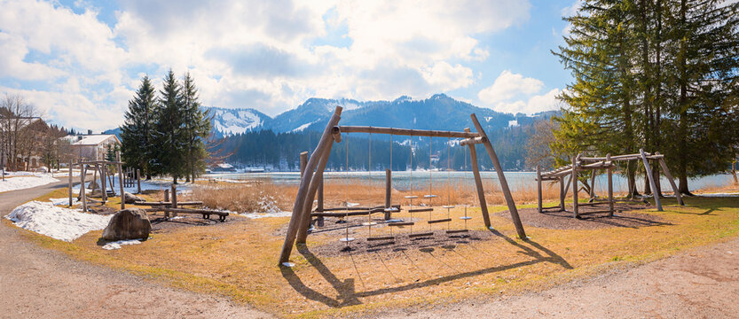 playground with wooden swings, seesaws, and motor skills equipment,  Lake Spitzingsee