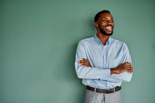 Portrait of a young happy businessman having a meeting or training in the office. Teamwork and success concept, portrait of a smart young businessman, student, teacher or coach