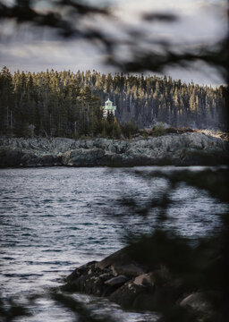 Little River Lighthouse barely visible through the trees, Maine