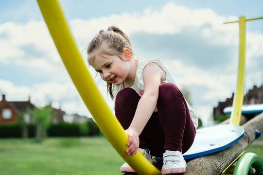 little girl playing outdoors, summer activities