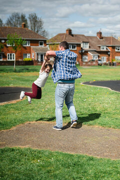Father and daughter playing together at playground