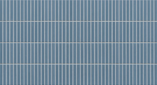 A detailed background of glossy blue ceramic wall tiles arranged in a modern vertical stacked pattern for sleek bathroom and kitchen interior designs.