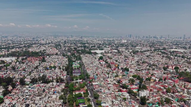 Cinematic drone orbit of a massive megacity with infinite urban sprawl, 4K D-Log.