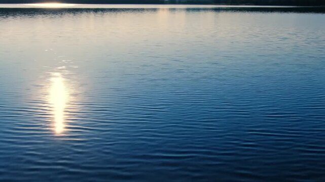 Thin fog drifting across lake horizon in seamless loop with minimal scene and right empty space