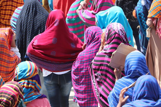 Unstoppable spirit: The dense flow of participants in a traditional cultural parade showcasing unity in diversity.
