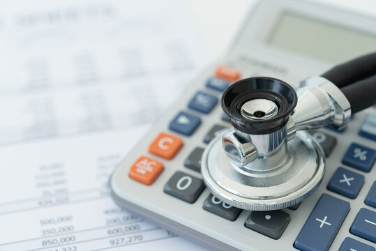 health insurance or medical expenses plan concept.  stethoscope on calculator with medical treatment expense on bill statement,