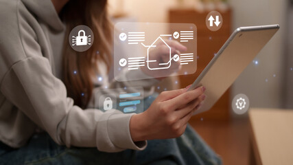 woman holding digital tablet with smart home security system automation interface application monitoring property protection lock notification control © STBSTD