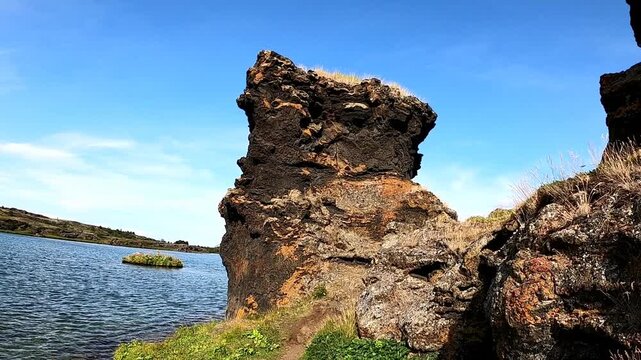 Dramatic volcanic lava pillar at Lake Myvatn shore, Iceland