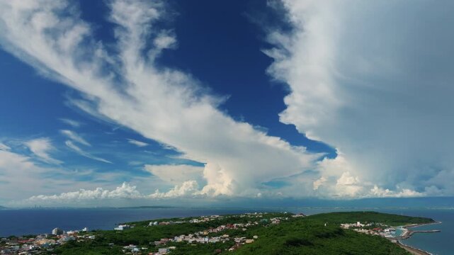 Aerial views of the island with clouds. Flying above the clouds