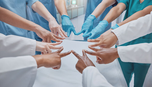 Diverse healthcare team members join together in a circle of unity, symbolizing collaboration and clinical excellence. Perfect for medical leadership and teamwork concepts in hospitals.