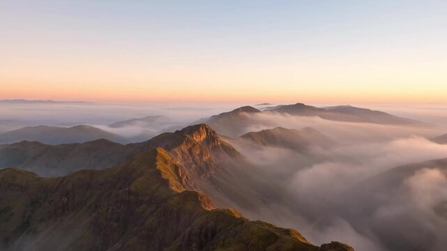 Video of a serene mountain range shrouded in misty clouds at dawn video
