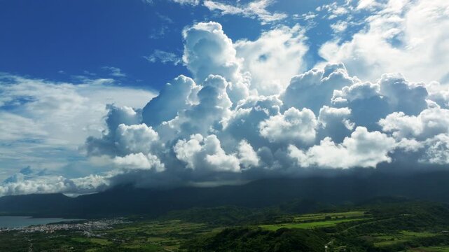 Aerial views of the countryside with clouds. Flying above the clouds