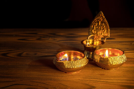 Diwali lamp diya or Deepavali or Deepawali. Hindu festival of lights. Celebrating in Indian religions Jainism and Sikhism. Offering to the gods, a spiritual rite. Close up view, out of focus