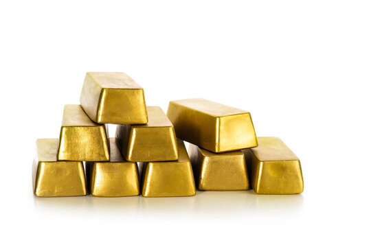 Gold bullion bars stacked on a white background, concept of personal savings, private investment, wealth storage, asset protection and financial planning.