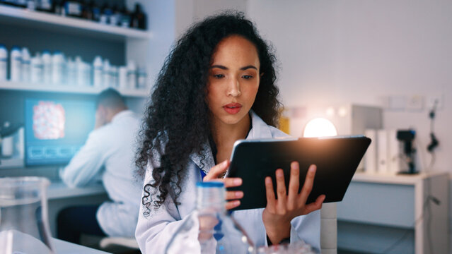Healthcare, science and woman in lab on tablet for medical review, clinical trial and vaccine development. Medicine, pharmaceutical and person on tech for research, data analysis and study results