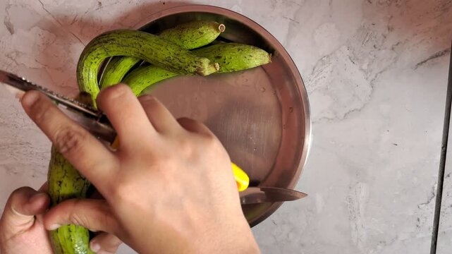 Peeling Sponge Gourd (Turai) with Precision