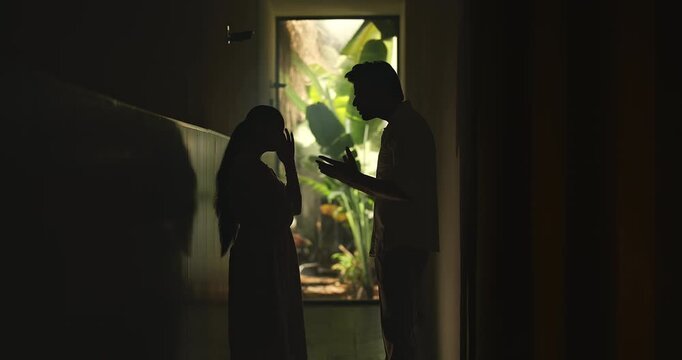 Indian upset tense young adult male female girl do fight argue shout on each other abuse living dark room place. Angry sad man woman wife couple talk speak lies feel bad have family issue money crisis