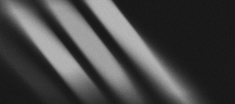 pattern of grayish-white gradient lines that divides a black background with a "grainy" texture.