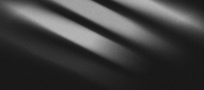 pattern of grayish-white gradient lines that divides a black background with a "grainy" texture.