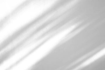 Obraz premium Soft Diagonal Window Shadows on Minimalist White Textured Wall Background