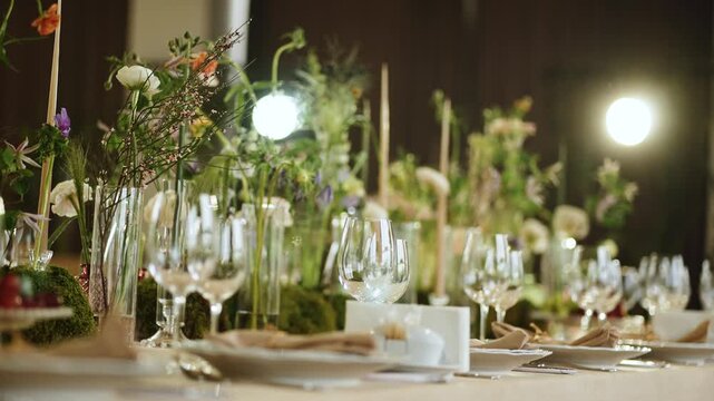Floral arrangement and table setup for a special event in a dining hall