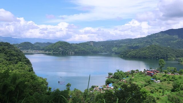 4K Time-lapse of Moving Clouds Over Begnas Lake and Green Hills in Nepal