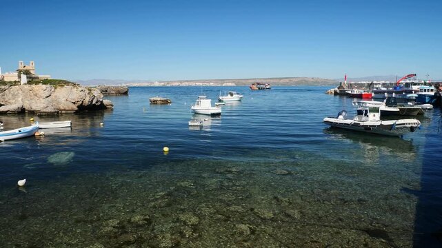 The crystal clear waters of the port on the island of Tabarca, Spain.. Slow motion x0,5