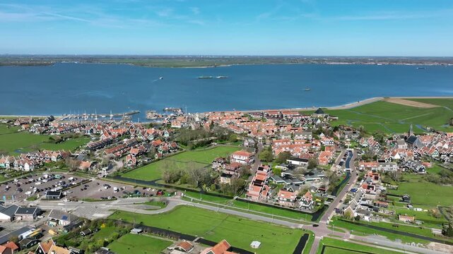 Historic lakeside village with prominent church in Europe