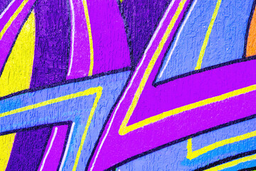 Fototapeta premium Abstract purple, yellow, blue graffiti, sharp geometric lines on textured urban wall. 90s, Y2K style, neon Street art, murals, urban backgrounds, creative banner, modern 2000s, Y2K social media visual