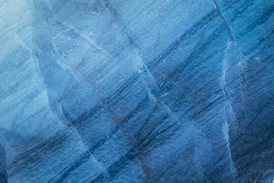 View of the deep blue glacial ice textures and cracks of the Svinafellsjokull glacier in Sveitarfelagid Hornafjordur, Iceland.