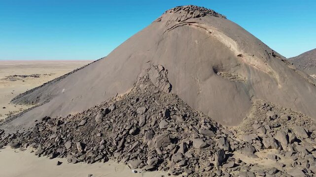 Close aerial drone view of Ben Amera monolith rock formation in Mauritania Sahara desert