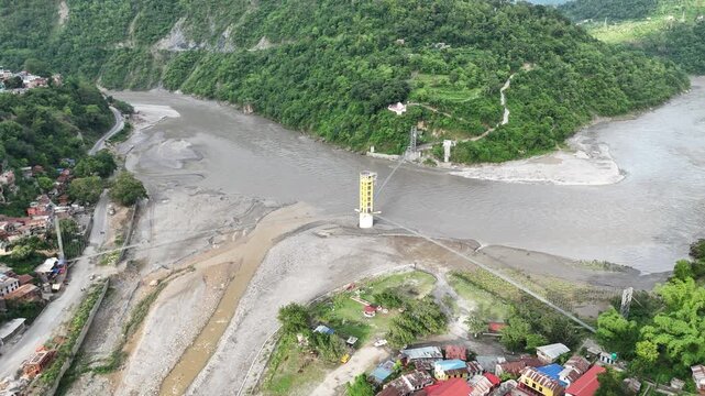 High-Angle 4K Drone Footage of Massive Central Bridge Pillar in Muddy River