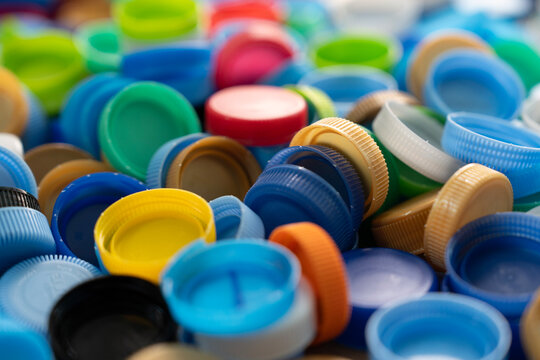 Close up plastic bottles caps for recycling to conserve the environment, recycling, reuse, garbage disposal, save the world concept., heart shape