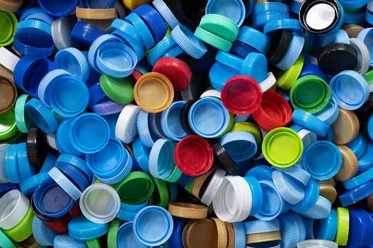 Close up plastic bottles caps for recycling to conserve the environment, recycling, reuse, garbage disposal, save the world concept.