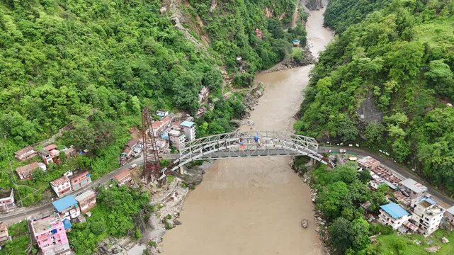 4K Drone Shot of Prithvi Highway Bridge Crossing a Scenic River Valley