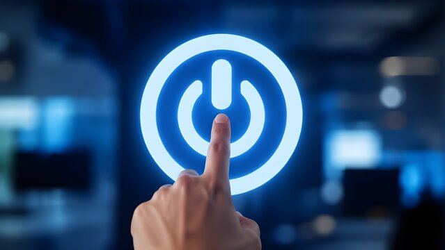 Finger pressing glowing power button icon for system start and energy concept