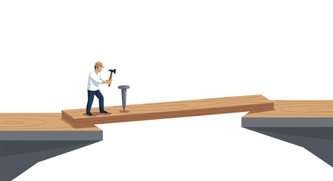 A construction worker creates a temporary bridge by hammering a nail into a wooden plank spanning a gap.