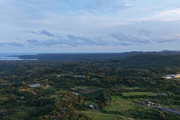 Obraz premium Aerial view of the Yanbaru forests and Higashi River basin in Higashi, Okinawa at sunset in April