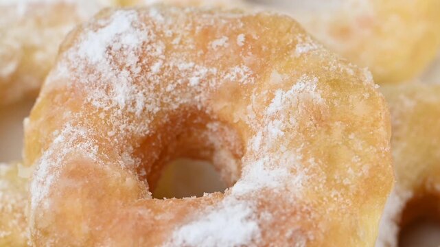 video of donuts coated in powdered sugar