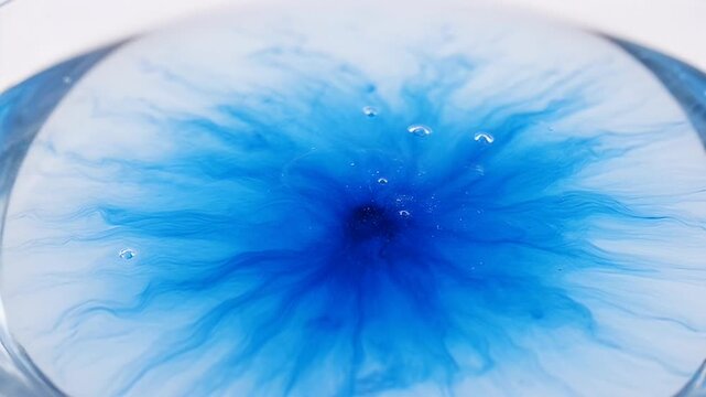 Vibrant Blue Ink Swirls in Water, Abstract Fluid Dynamics, Macro Droplet Diffusion, Microscopic Chemical Reaction, Science Experiment Background