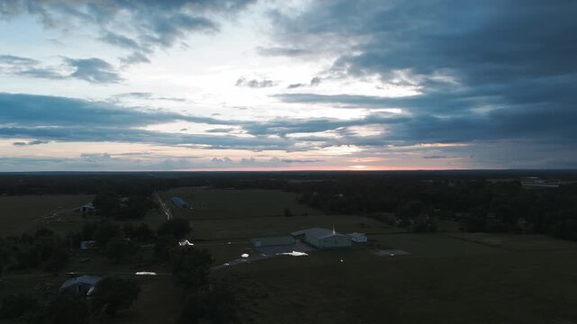 Dramatic Sky Over Cornerstone Baptist Church At Dusk In Gentry, Arkansas, United States. Aerial Wide Shot