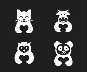 Obraz premium Cute minimalist animal logos featuring heart shapes: cat, cow, owl, and panda vector icons on a black background, representing love and care.