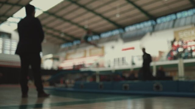 Trampoline acrobatics performed during gymnastics training