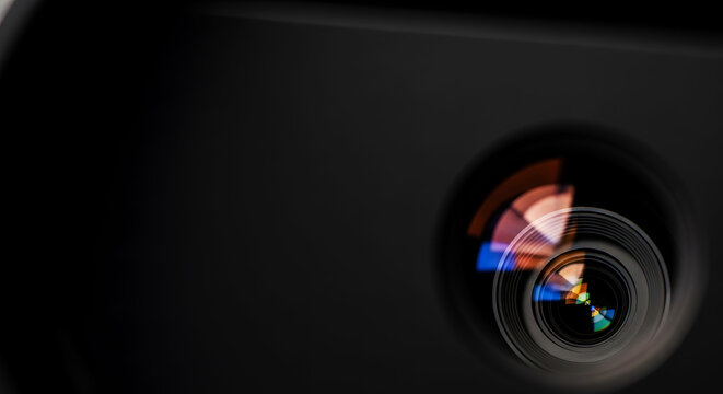 Professional camera lens front element with multi colored optical reflections