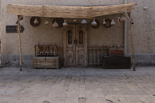 View of a traditional wooden door with a reed awning, hanging gourds, and antique chests on a stone pavement Tashkent, Uzbekistan.