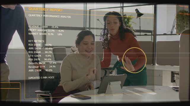 Seated analyst tapping tablet, biz HUD showing Qtr data for review, circle tracking, team cheering